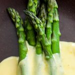 Elegant Steamed Asparagus Served With A Hollandaise Butter Sauce